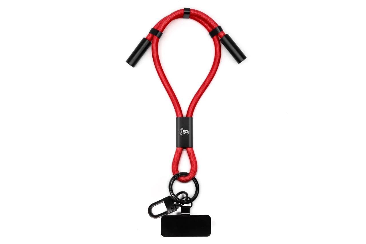 Anti-theft phone guard in wrist strap with fast charging features in Black, Blue, White, Orange and Red.