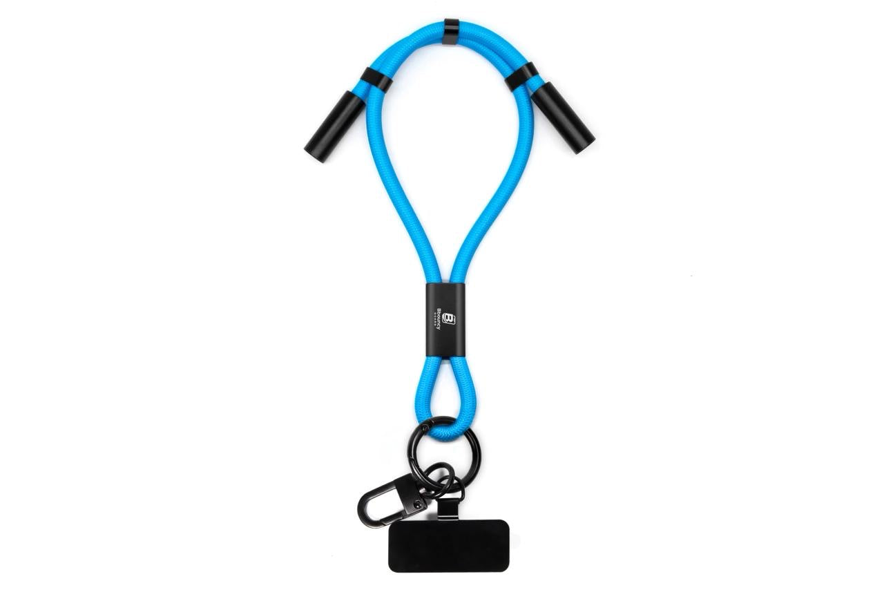 Anti-theft phone guard in wrist strap with fast charging features in Black, Blue, White, Orange and Red.