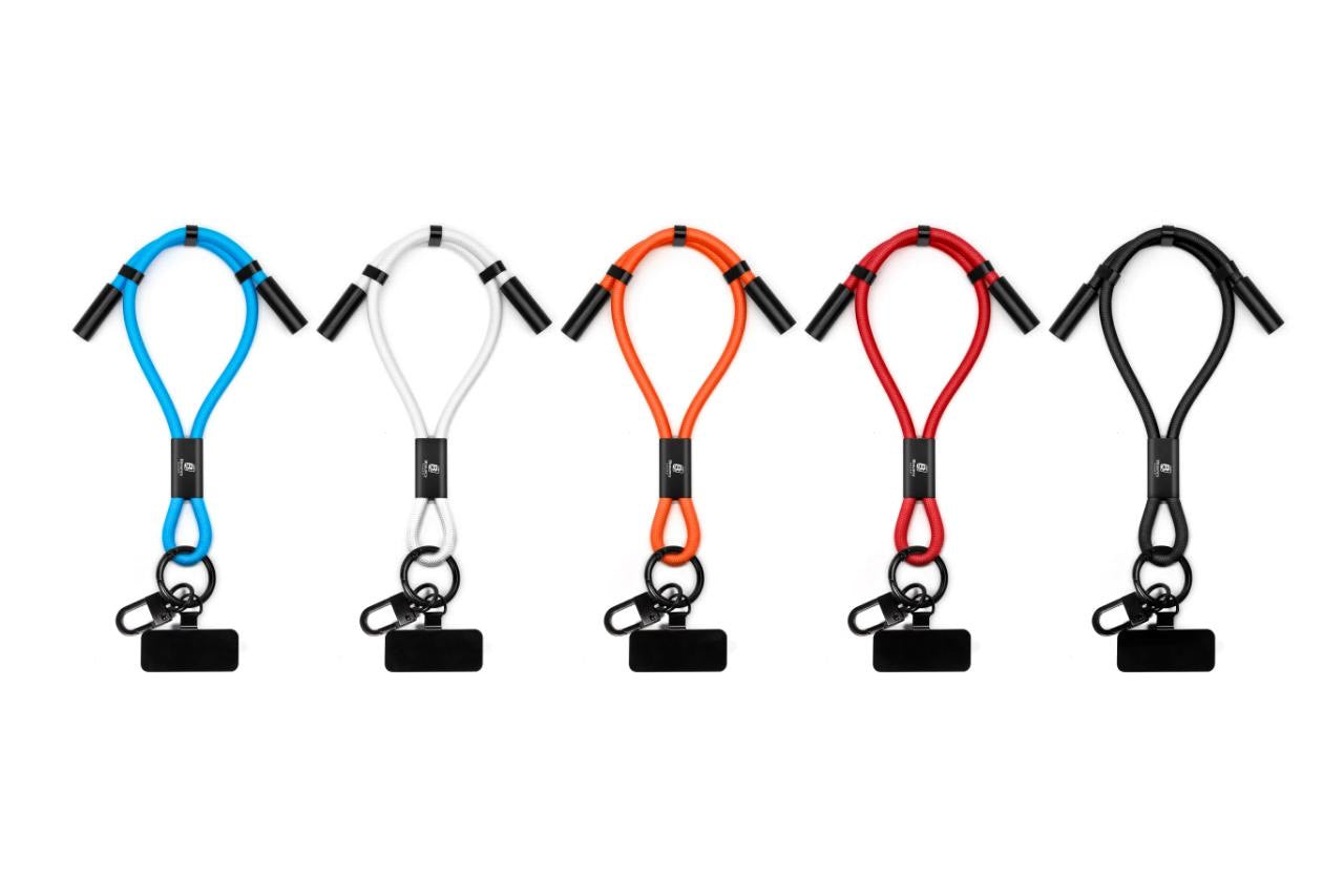 Anti-theft phone guard in wrist strap with fast charging features in Black, Blue, White, Orange and Red.